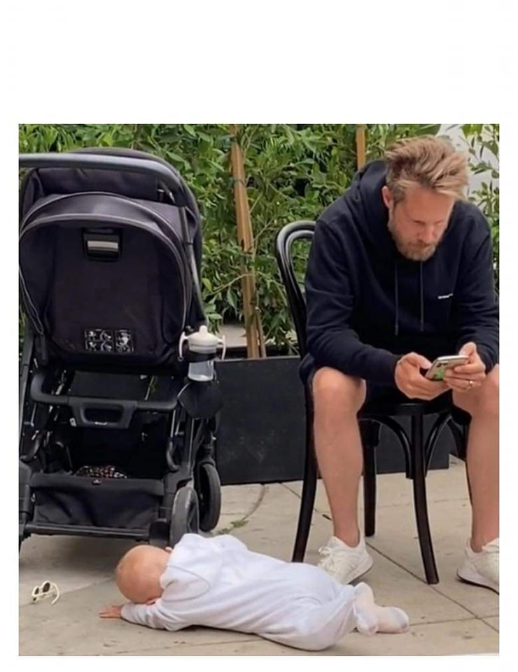 Man on phone baby on ground Blank Meme Template