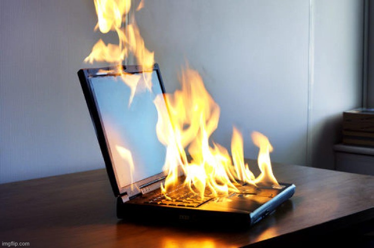 Burning laptop | image tagged in burning laptop | made w/ Imgflip meme maker