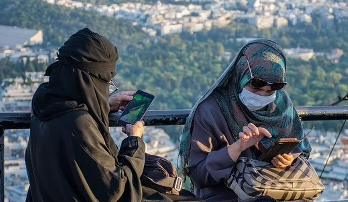 Two Muslim women burqa burka smartphones Blank Meme Template