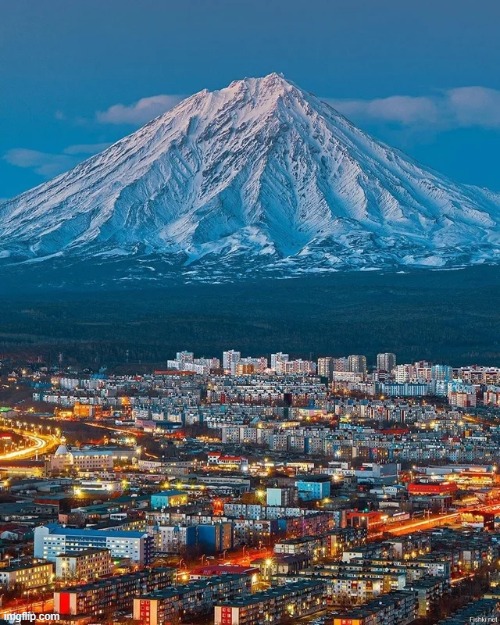 Koryaksky volcano overlooking Petropavlovsk-Kamchatsky city | image tagged in awesome pics | made w/ Imgflip meme maker