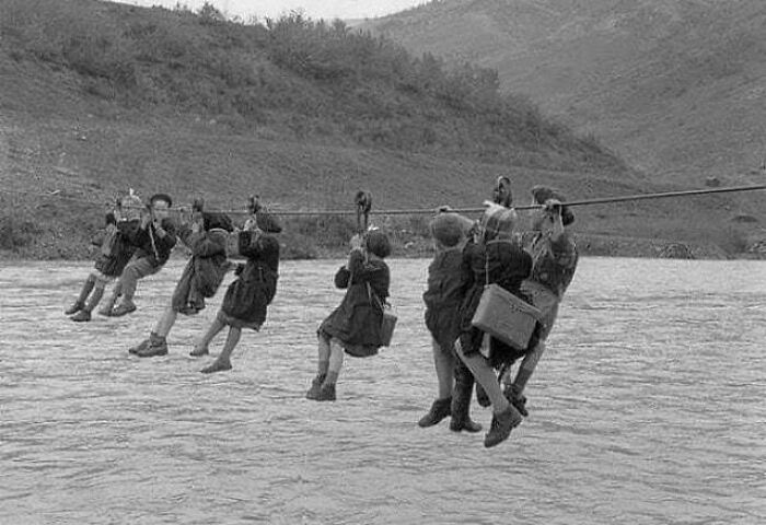 Children Going To School Having To Cross A River By Pulley, Modena, Italy, 1959 | image tagged in awesome,pics,photography | made w/ Imgflip meme maker