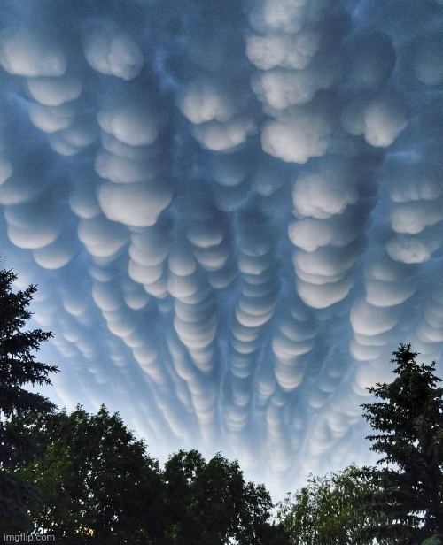 Mammatus clouds | image tagged in strange,clouds,awesome,photography | made w/ Imgflip meme maker