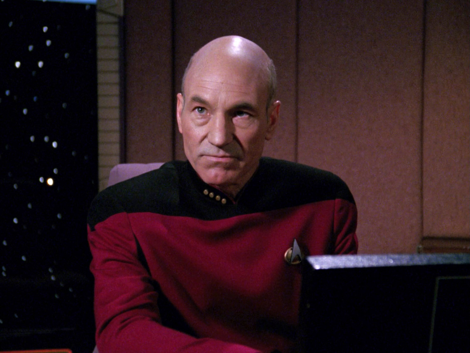 PICARD LOOKS UP FROM THE MONITOR ANGRILY Blank Meme Template