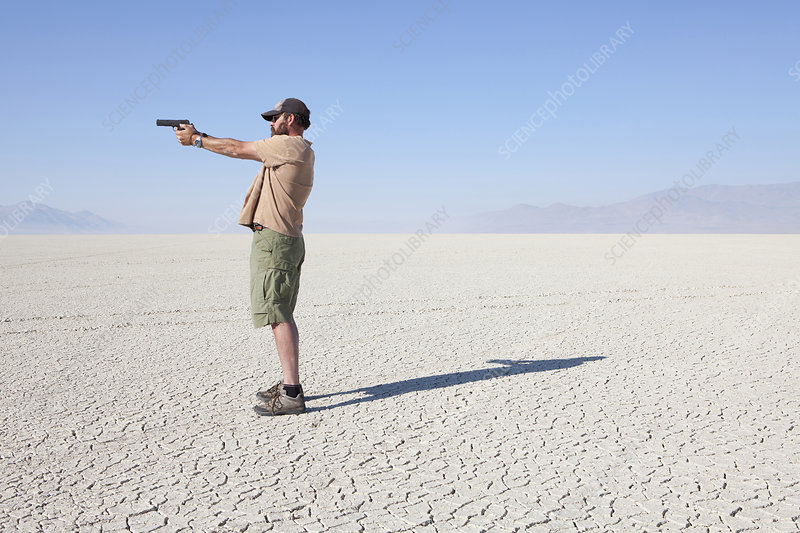 Guy with Gun In The Desert Blank Meme Template