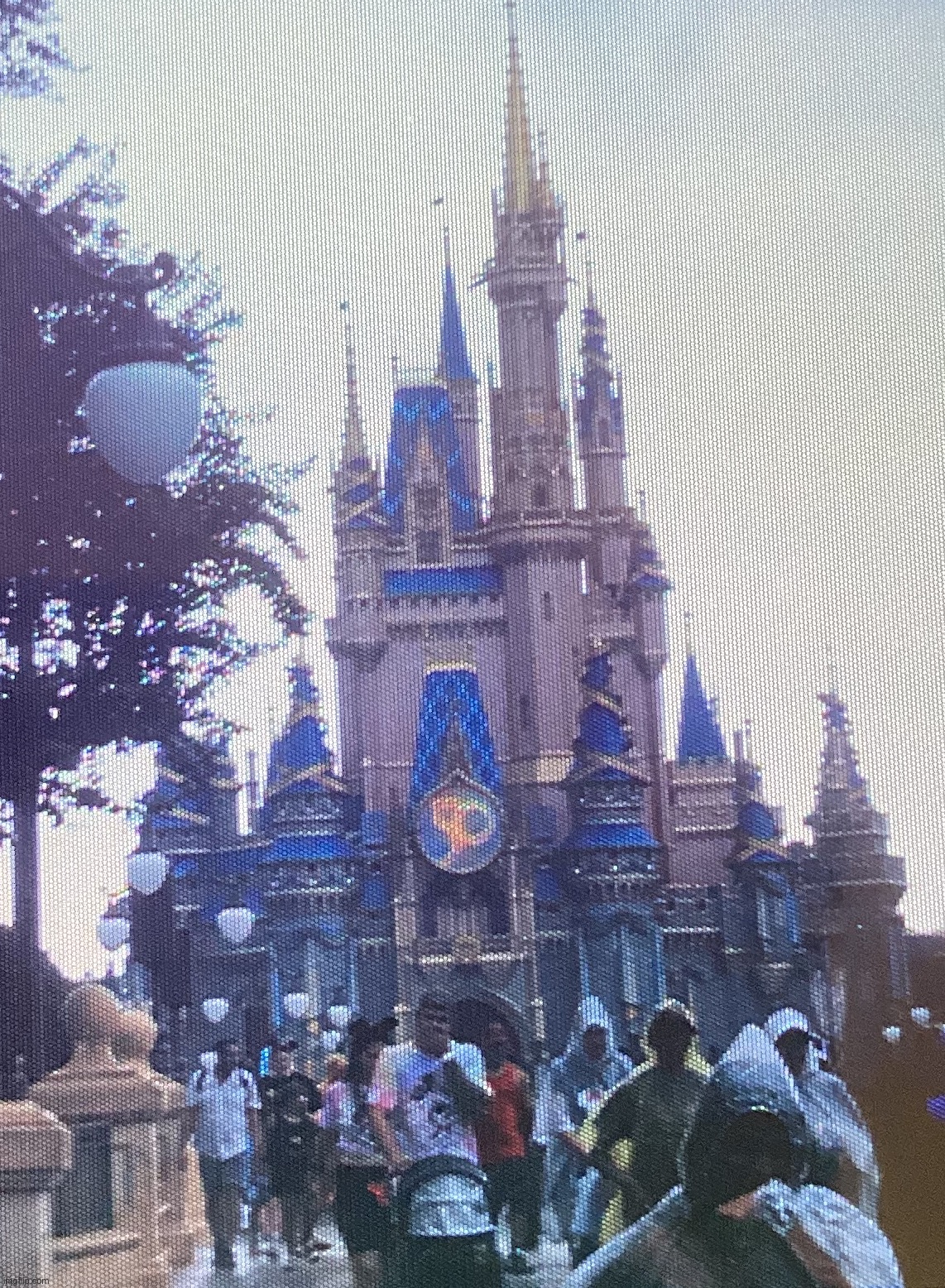 A picture of the Cinderella Castle decked out in 50th attire, taken with an old camera | image tagged in share your own photos | made w/ Imgflip meme maker