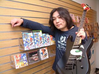 High Quality Jun senoue holding guitar plus games Blank Meme Template