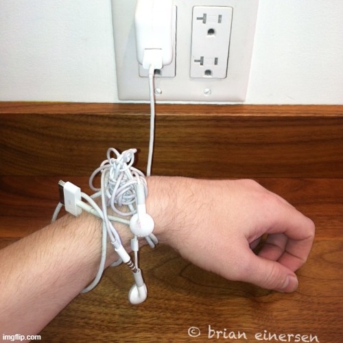 Khained To My Kharger | image tagged in social commentary,iphone charger,kreative outlet,creative outlets,hand moodel,brian einersen | made w/ Imgflip meme maker