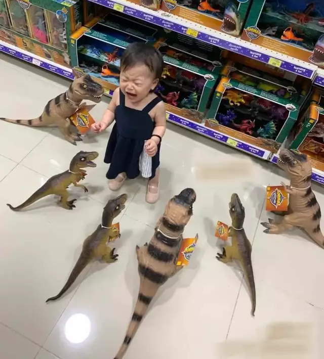 High Quality Child surrounded by dinosaurs Blank Meme Template