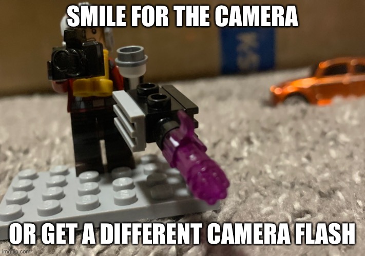 SMILE FOR THE CAMERA; OR GET A DIFFERENT CAMERA FLASH | image tagged in lego,minigun,camera | made w/ Imgflip meme maker