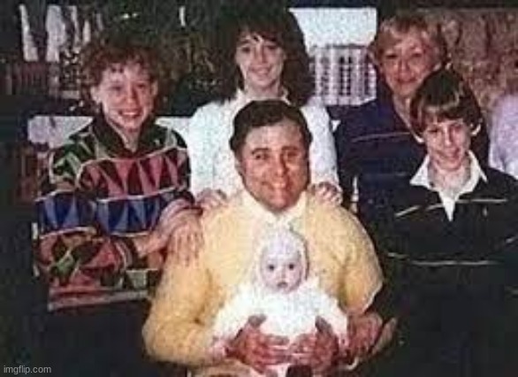 Images with Disturbing Backstories #8| Family Photo? | image tagged in the guy holding the child,killed the mother of that child,and kidnapped her | made w/ Imgflip meme maker