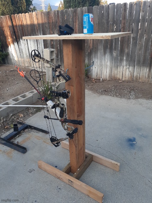 My new bowstand complete with arrow quiver and table for drinks | image tagged in country,diy,jealous | made w/ Imgflip meme maker