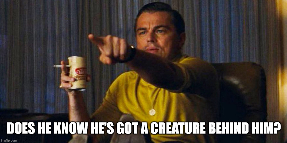 Leo pointing | DOES HE KNOW HE'S GOT A CREATURE BEHIND HIM? | image tagged in leo pointing | made w/ Imgflip meme maker