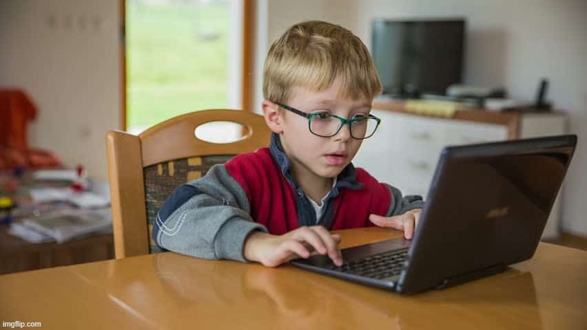 Kid With A Computer | image tagged in kid with a computer | made w/ Imgflip meme maker