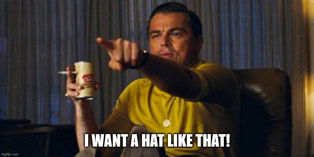 Leo pointing | I WANT A HAT LIKE THAT! | image tagged in leo pointing | made w/ Imgflip meme maker