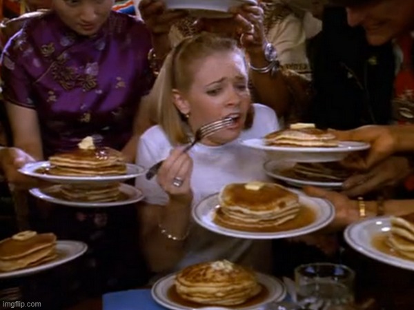 Girl being fed pancakes | image tagged in girl being fed pancakes | made w/ Imgflip meme maker