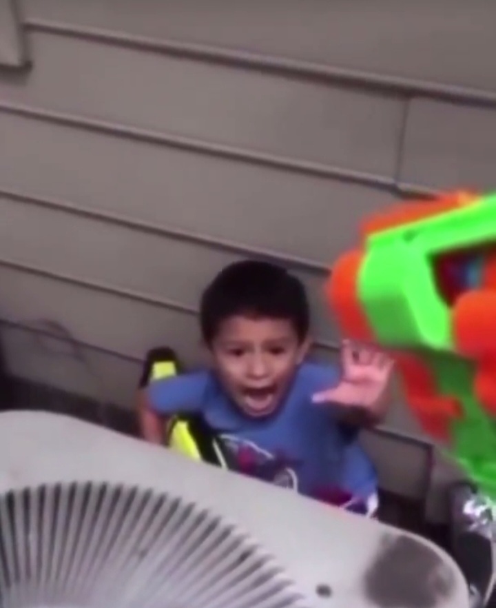 Nerf gun pointed at dramatic kid Blank Meme Template