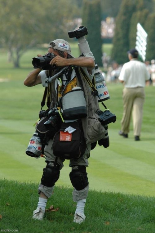 Photographer with too many cameras | image tagged in photographer with too many cameras | made w/ Imgflip meme maker