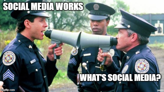 Police Arguing | SOCIAL MEDIA WORKS; WHAT'S SOCIAL MEDIA? | image tagged in police arguing | made w/ Imgflip meme maker