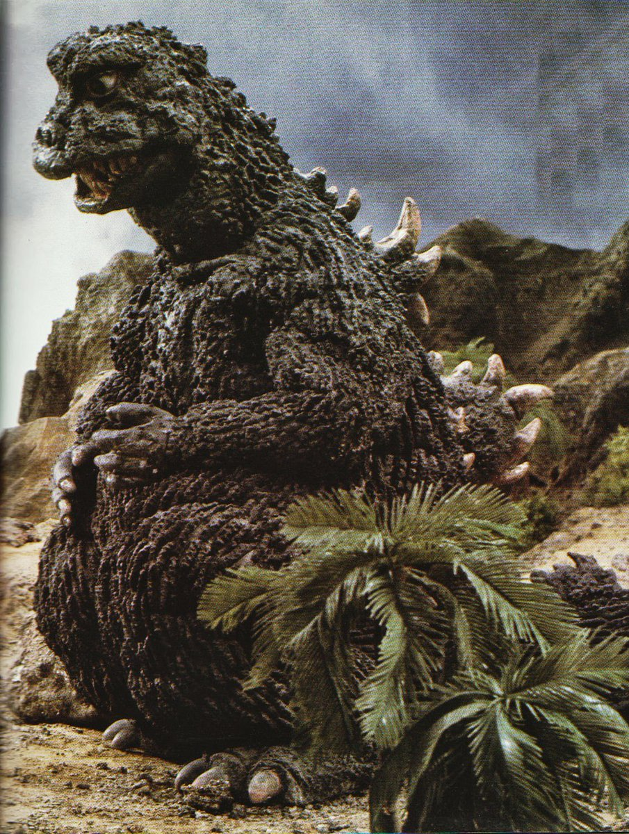 High Quality Godzilla sitting on his butt not getting stuff done Blank Meme Template