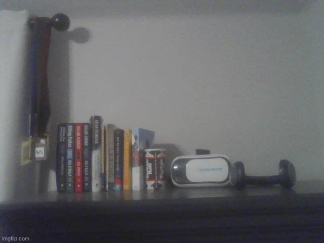 Some books on top of my trunk (also with a coin jar, VR headset and some headphones) | made w/ Imgflip meme maker
