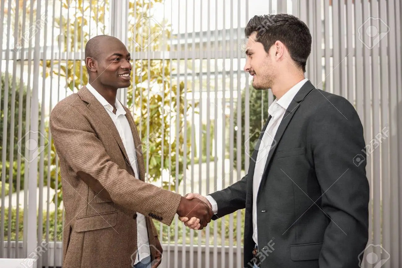 Black man and White man shaking hands Blank Meme Template