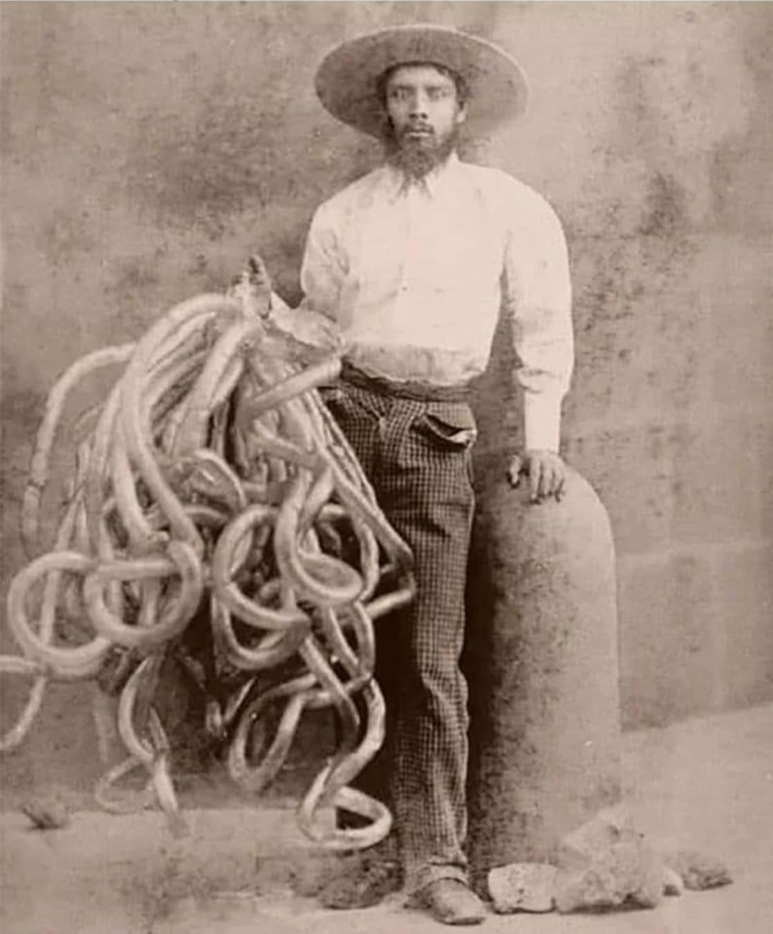 A Mexican Vendor selling inflated intestines in a market in the Blank Meme Template