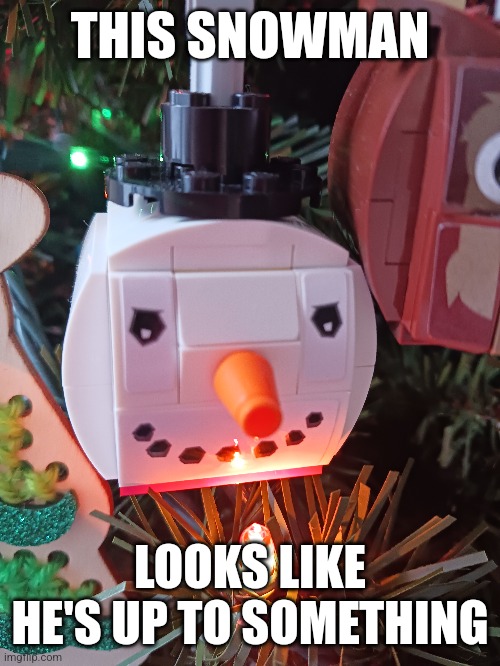 Sus snowman | THIS SNOWMAN; LOOKS LIKE HE'S UP TO SOMETHING | image tagged in snowman,lego,christmas decorations,christmas tree,christmas,evil | made w/ Imgflip meme maker