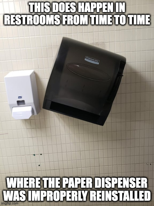 Graduate Alma Matar Paper Dispenser | THIS DOES HAPPEN IN RESTROOMS FROM TIME TO TIME; WHERE THE PAPER DISPENSER WAS IMPROPERLY REINSTALLED | image tagged in restroom,memes,college | made w/ Imgflip meme maker