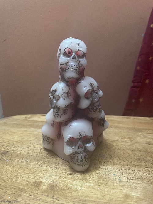 This is a photo of a skull candle that I got for Christmas. It bleeds when you light it | image tagged in photography,photos,candle | made w/ Imgflip meme maker