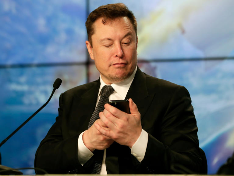 Elon Musk checks his phone Blank Meme Template