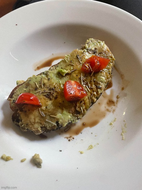 This is avocado toast with Balsamic Vinegar, Grape Tomatoes, and Rosemary. | image tagged in avocado,toast,breakfast | made w/ Imgflip meme maker