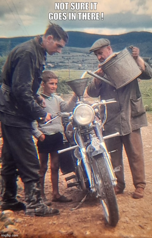 Matchless twin motorbike re fuel | NOT SURE IT GOES IN THERE ! | image tagged in motorbike,fuel,watering can | made w/ Imgflip meme maker