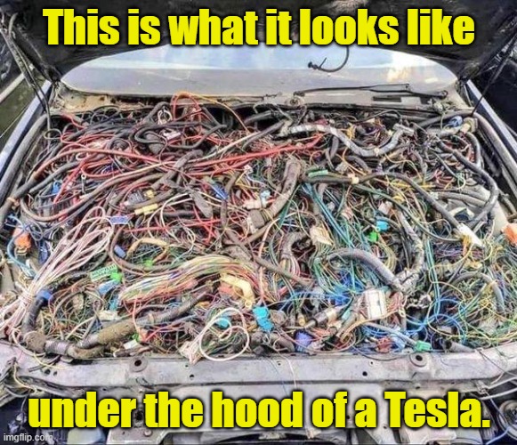 Under the hood of a Tesla | This is what it looks like; under the hood of a Tesla. | image tagged in tesla,under the hood | made w/ Imgflip meme maker