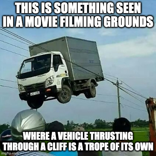 Flying Truck | THIS IS SOMETHING SEEN IN A MOVIE FILMING GROUNDS; WHERE A VEHICLE THRUSTING THROUGH A CLIFF IS A TROPE OF ITS OWN | image tagged in cars,truck,memes | made w/ Imgflip meme maker