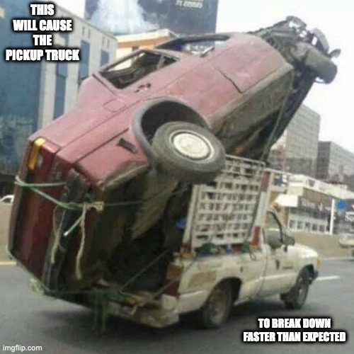 Broken Car Strapped on a Pickup Truck | THIS WILL CAUSE THE PICKUP TRUCK; TO BREAK DOWN FASTER THAN EXPECTED | image tagged in cars,memes | made w/ Imgflip meme maker