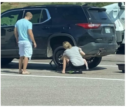 woman changing tire Blank Meme Template