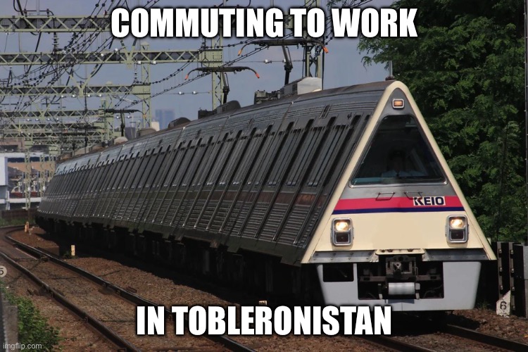 Tobleronistan | COMMUTING TO WORK; IN TOBLERONISTAN | image tagged in toblerone,chocolate,train,triangle | made w/ Imgflip meme maker