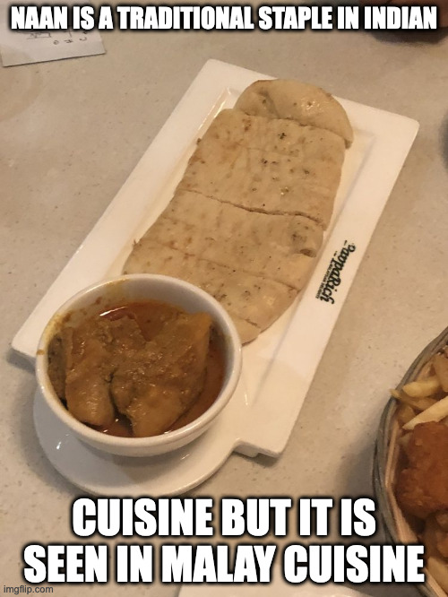 Naan in a Malay Restaurant | NAAN IS A TRADITIONAL STAPLE IN INDIAN; CUISINE BUT IT IS SEEN IN MALAY CUISINE | image tagged in food,memes | made w/ Imgflip meme maker