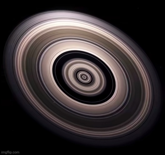 The planet in the middle is twice the size of Saturn, this a real planet with huge ass rings | made w/ Imgflip meme maker