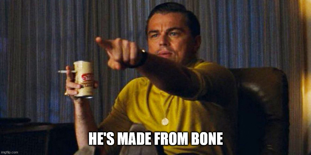 Leo pointing | HE'S MADE FROM BONE | image tagged in leo pointing | made w/ Imgflip meme maker