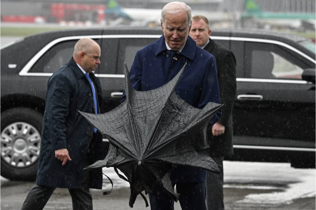 Joe Biden struggles with umbrella Blank Meme Template
