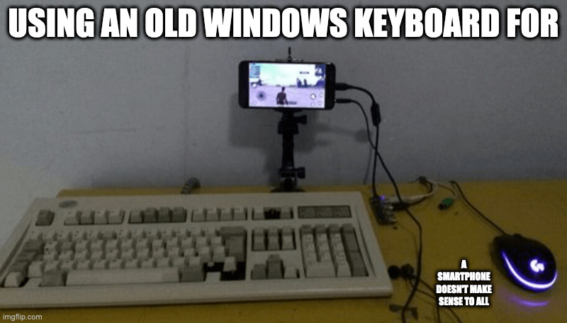 Old Keyboard Connected to a Smartphone | USING AN OLD WINDOWS KEYBOARD FOR; A SMARTPHONE DOESN'T MAKE SENSE TO ALL | image tagged in computer,phone,memes | made w/ Imgflip meme maker