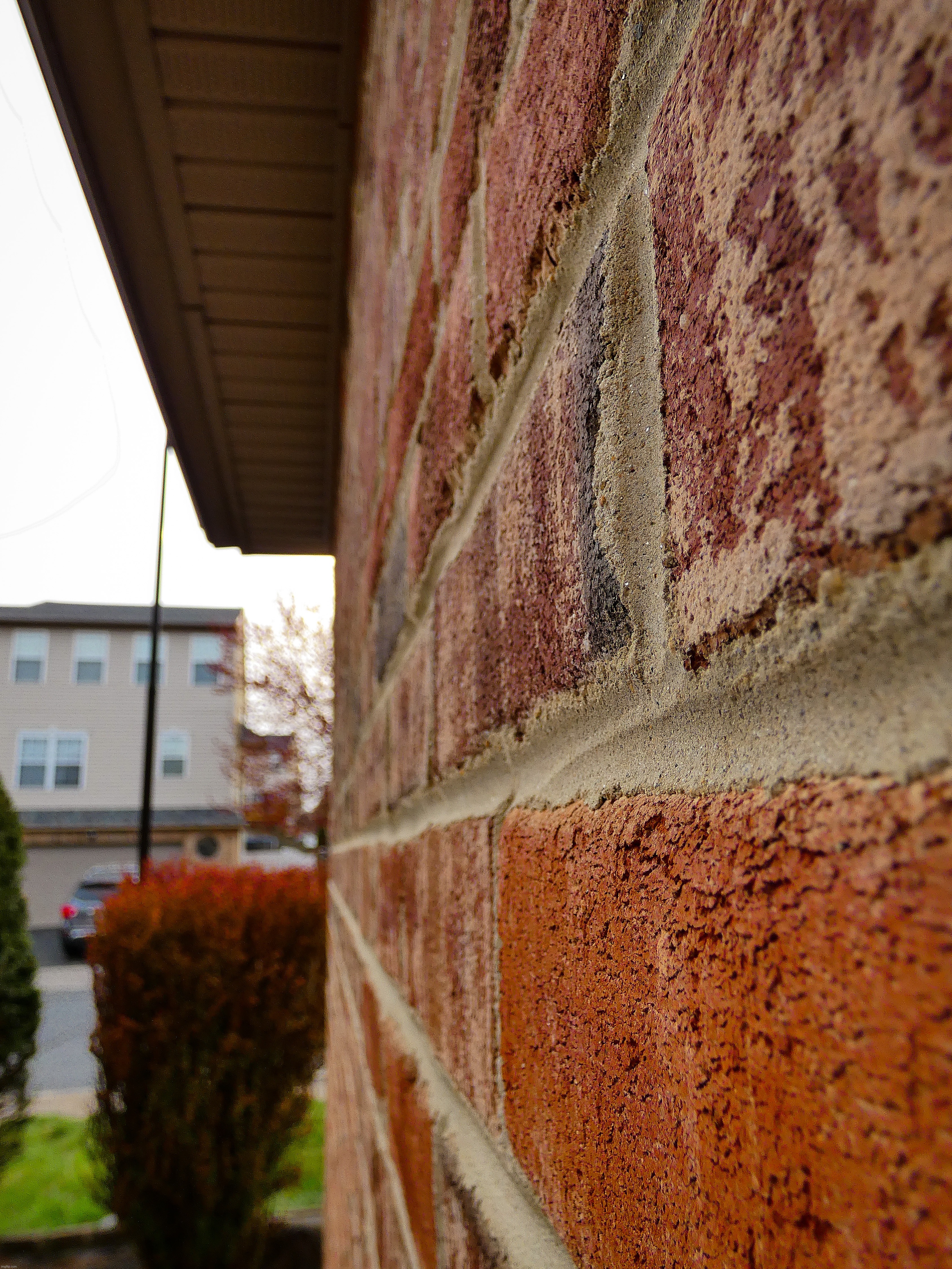 A cool side view of a brick wall | image tagged in share your own photos | made w/ Imgflip meme maker