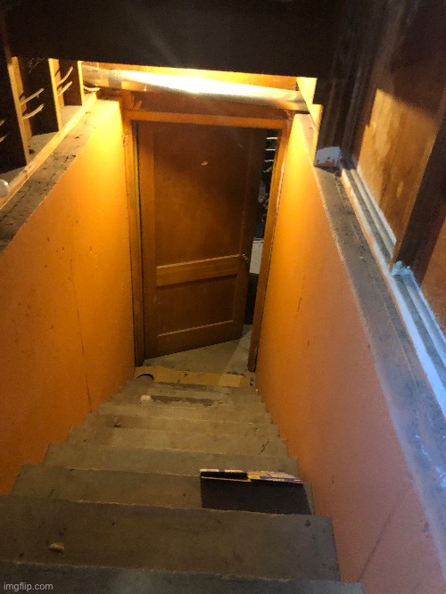 The stair to my basement is a scene from a horror movie | image tagged in i ran back to my garage door | made w/ Imgflip meme maker