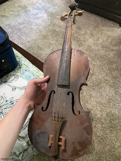 A fiddle that what would be my great great granddad owned | image tagged in fiddle,old,it has a rattlesnake rattle in it | made w/ Imgflip meme maker