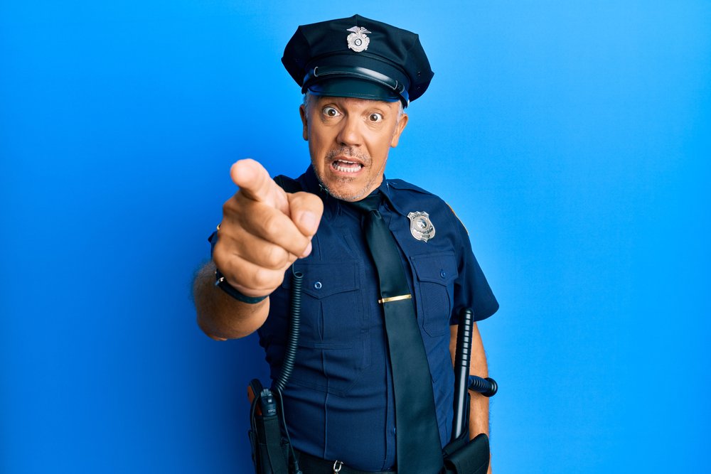 Uniform cop standing and pointing Blank Meme Template