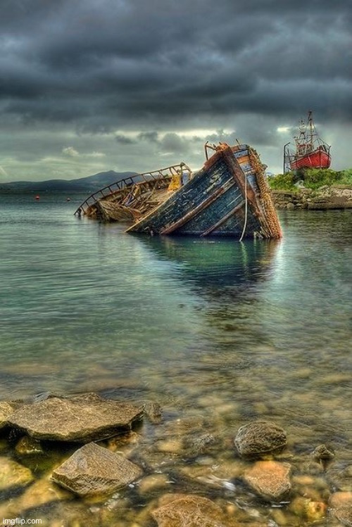 Sunken wreck | image tagged in watery grave,sunken,one high and dry,blue and red boats,north donegal,ireland | made w/ Imgflip meme maker