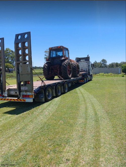 New tractor delivered! | image tagged in tractor,truck,grass | made w/ Imgflip meme maker