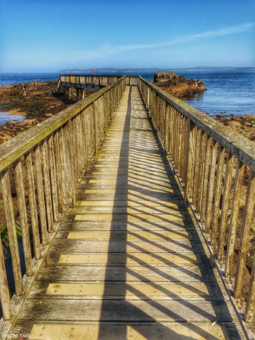 Walkway with view of Rathlin Island | image tagged in walkway on ballycastle beach,rathlin island,off north antrim coast,northern ireland | made w/ Imgflip meme maker
