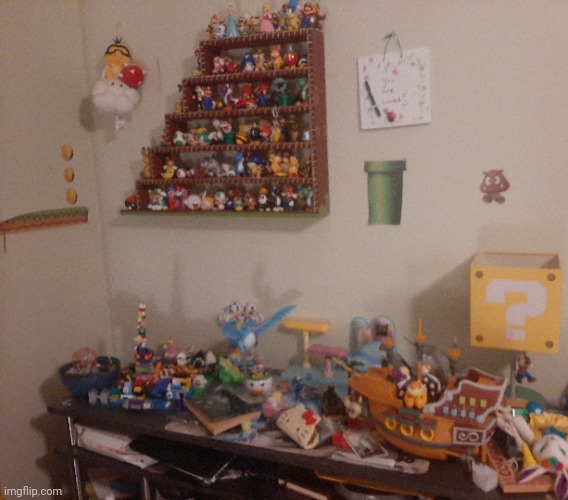 The shelf my mom made for my Mario figures (ignore the mess on my desk) | image tagged in mario figures,collection | made w/ Imgflip meme maker